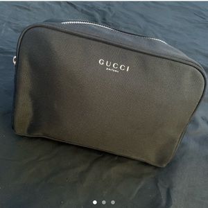 Black Gucci perfume/makeup clutch bag